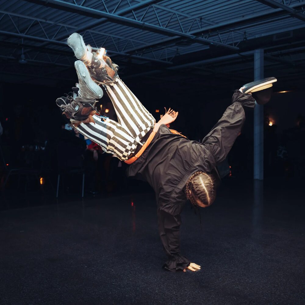 Breakdance freeze in striped costume